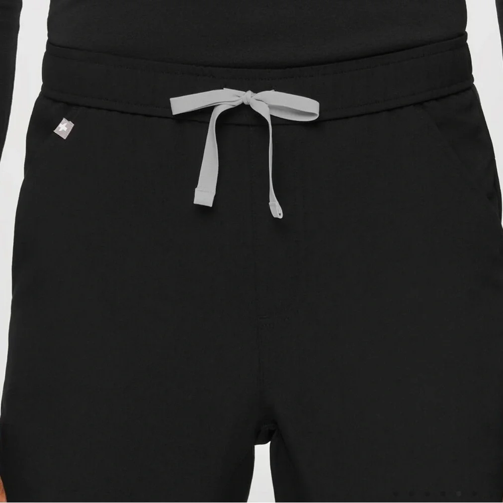 FIGS Men’s Tansen‎ Jogger Scrub Pants in Black.